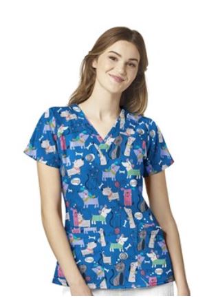 Woman wearing blue patterned scrubs available at Coastal 